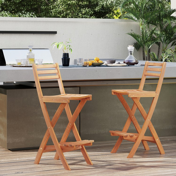 Set of 2 acacia wood bar height chairs with backrest and footrest, ideal for outdoor backyard seating.