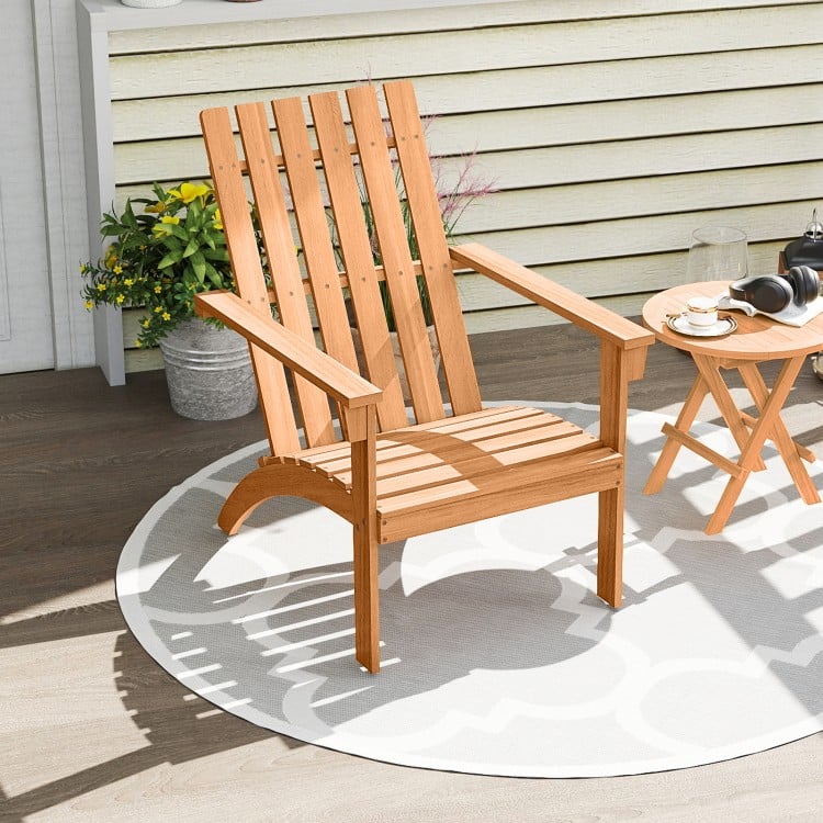 Natural acacia wood Adirondack chair with ergonomic backrest, ideal for porch or backyard relaxation.