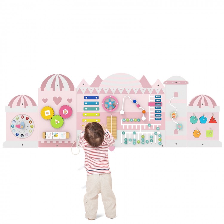 Activity wall busy board for toddlers featuring a pink castle design with various interactive sensory activities for.