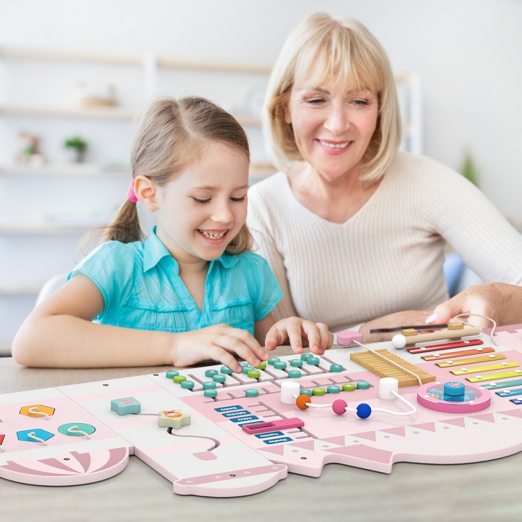 Wooden pink activity wall busy board with xylophone, clock, and abacus, engaging toddlers in sensory play and learning.