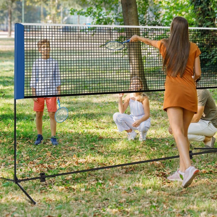 Adjustable 10-foot badminton net stand set up in a park, ideal for sports like badminton and volleyball, with portable.
