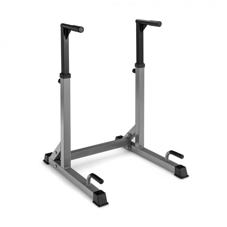 Adjustable multi-function dip-up station in red and silver with heavy-duty steel construction for home gym workouts.