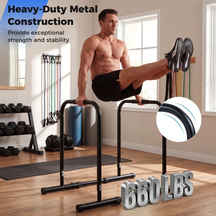 Adjustable dip bar station in black with heavy-duty metal construction, supporting 660 lbs for versatile home workouts.