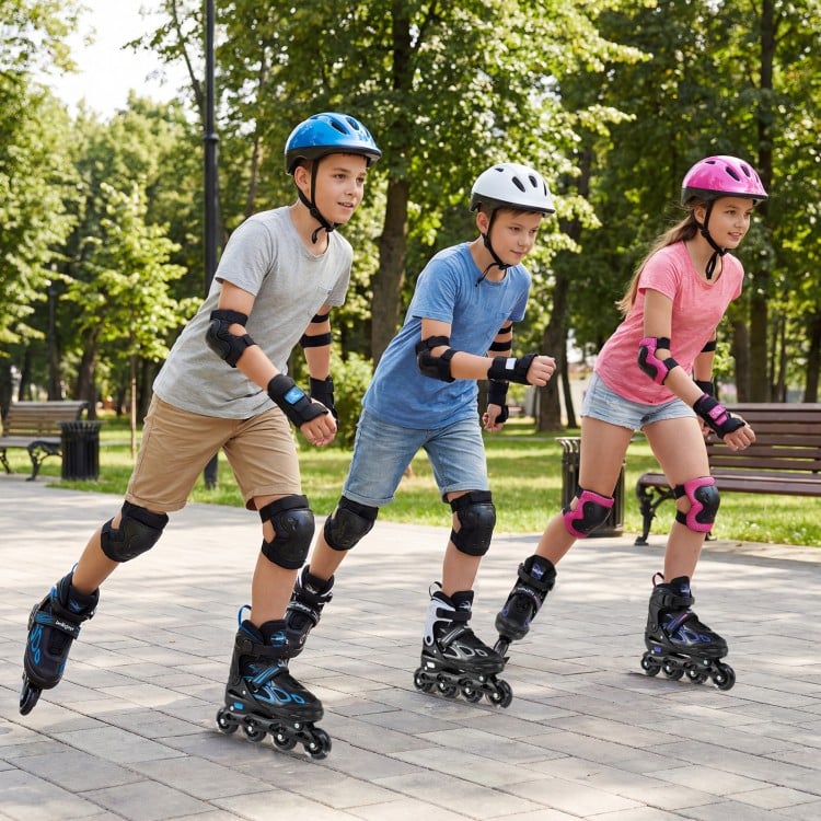 Kids wearing Adjustable Incline Skates with illuminating wheels, skating in a park for fun and safety.