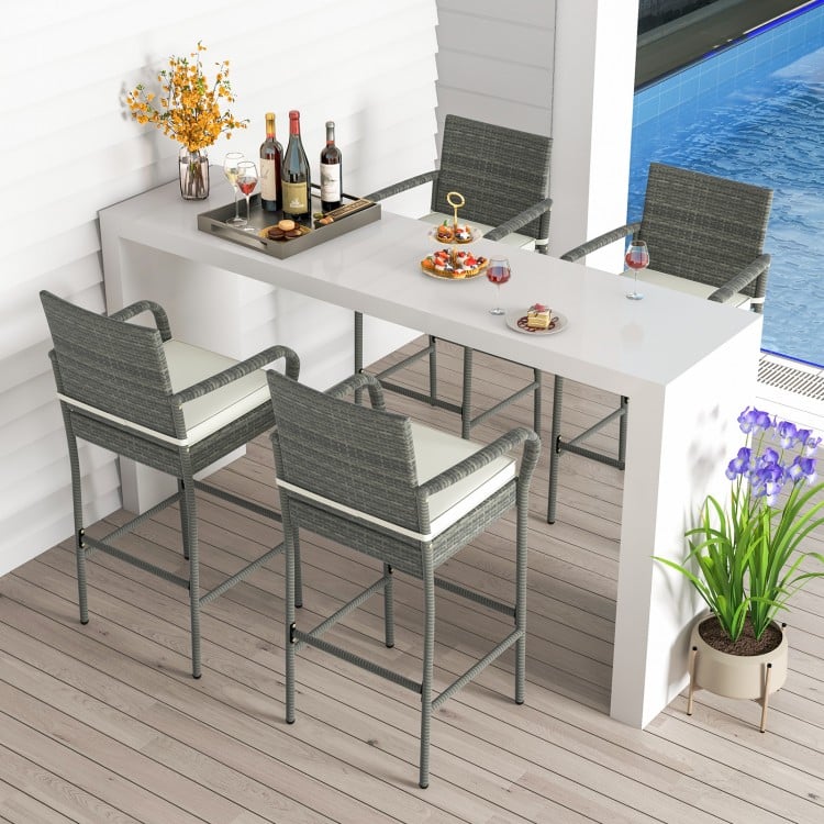 All-weather PE rattan bar chairs set of 4 with armrests and cushions, ideal for backyard and poolside relaxation.