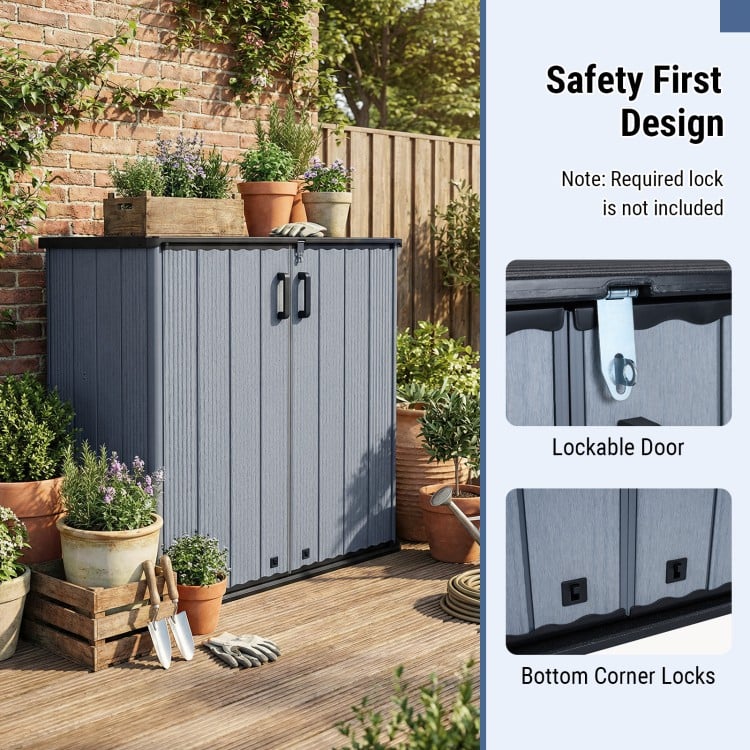 Gray all-weather storage box with lockable door and removable shelf, ideal for organizing patio and lawn items.