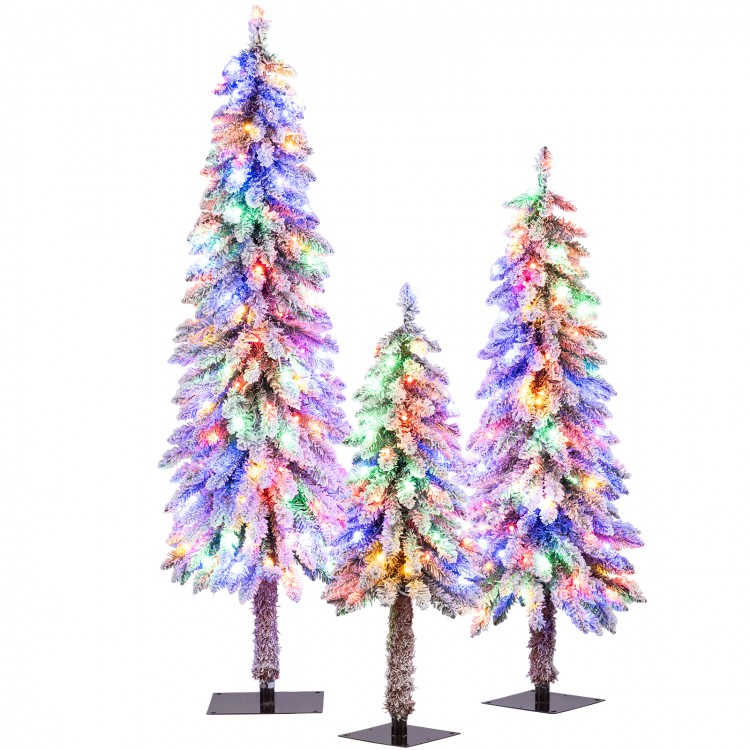 Artificial Christmas tree trio with snow-flocked tips and vibrant multi-color LED lights, perfect for festive indoor.