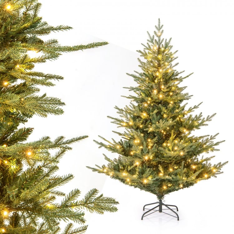 6-foot artificial Christmas tree with warm white LED lights and realistic branch tips, perfect for holiday decoration.