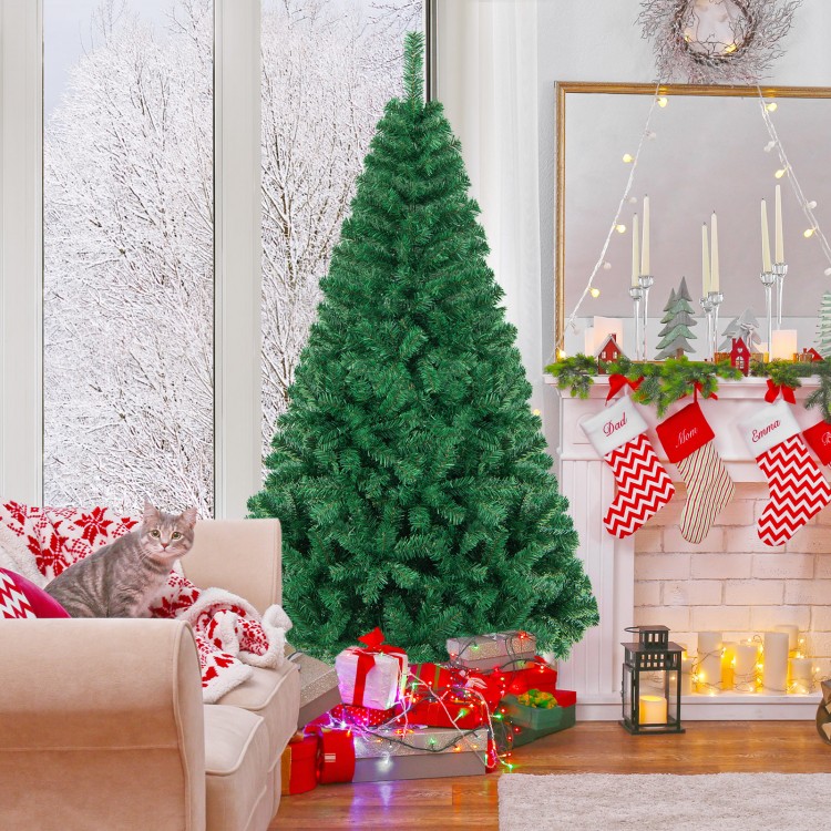 6 ft artificial PVC hinged Christmas tree with solid metal stand, decorated for indoor holiday settings.
