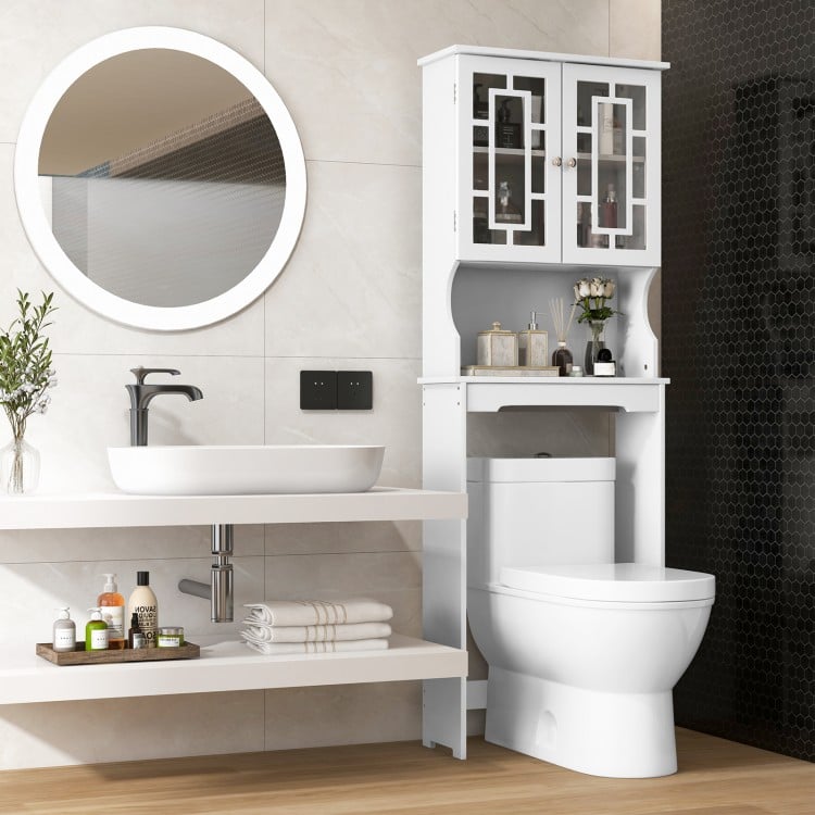 Bathroom spacesaver over the toilet with white finish, featuring a cabinet and open shelf for organizing toiletries.