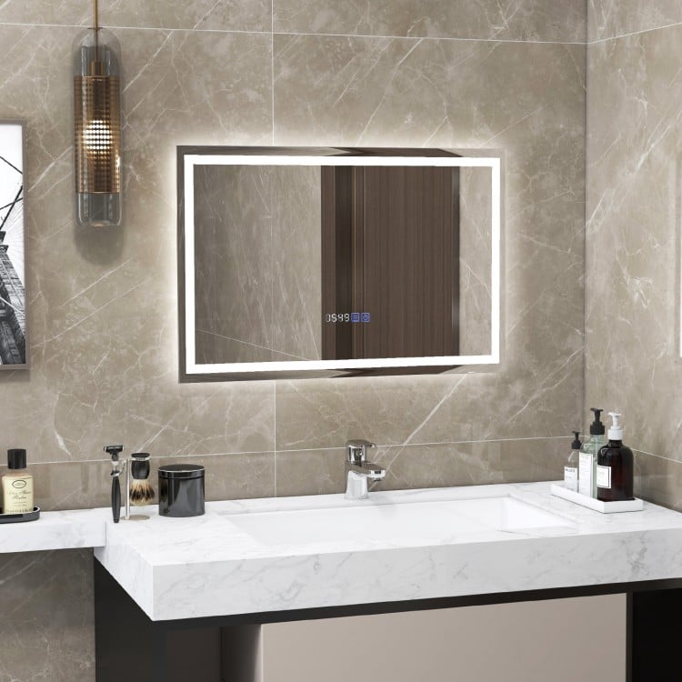 LED bathroom mirror with adjustable 3-color dimmable lights, featuring touch controls and a sleek rectangular design.