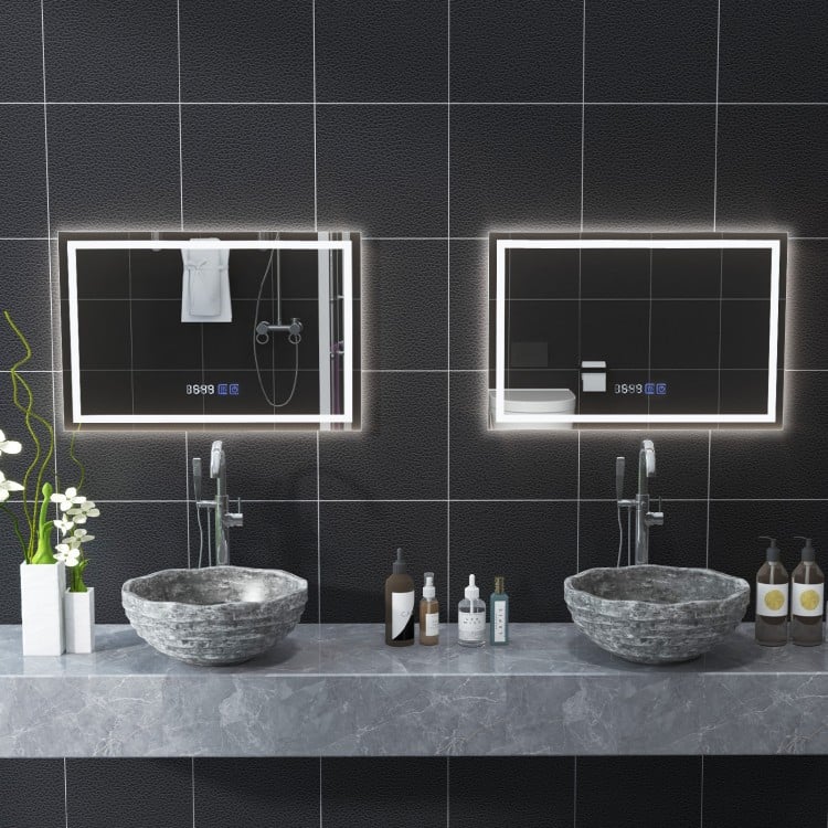 LED bathroom mirror with adjustable 3-color dimmable lights and anti-fog function, mounted above stylish stone sinks.