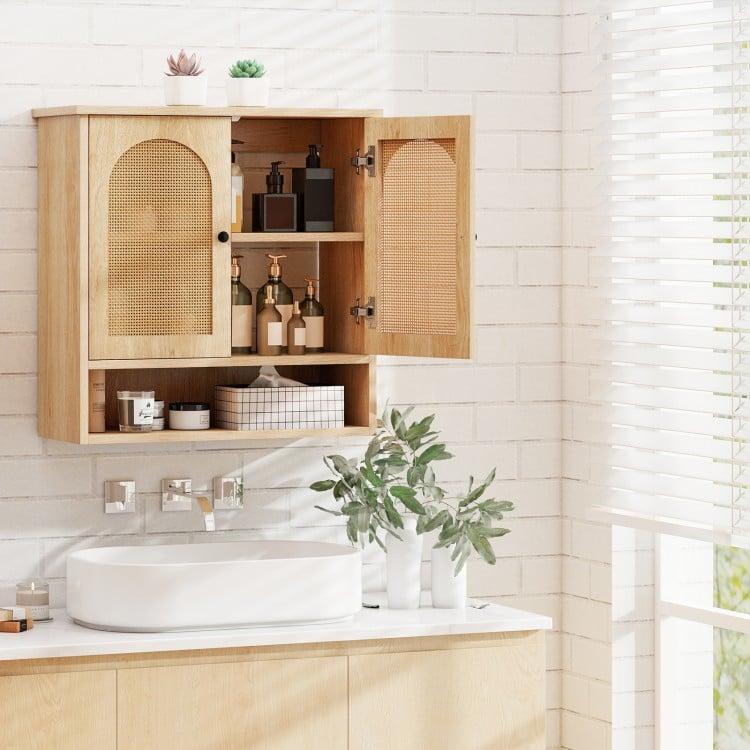 Natural wood bathroom wall cabinet showcasing PE rattan doors and an open cube for easy access to towels and toiletries.