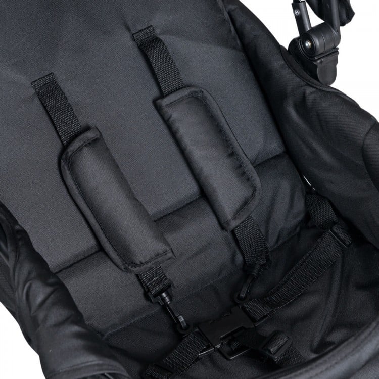Close-up of the black double baby stroller's adjustable 5-point safety belt for secure seating for two babies.