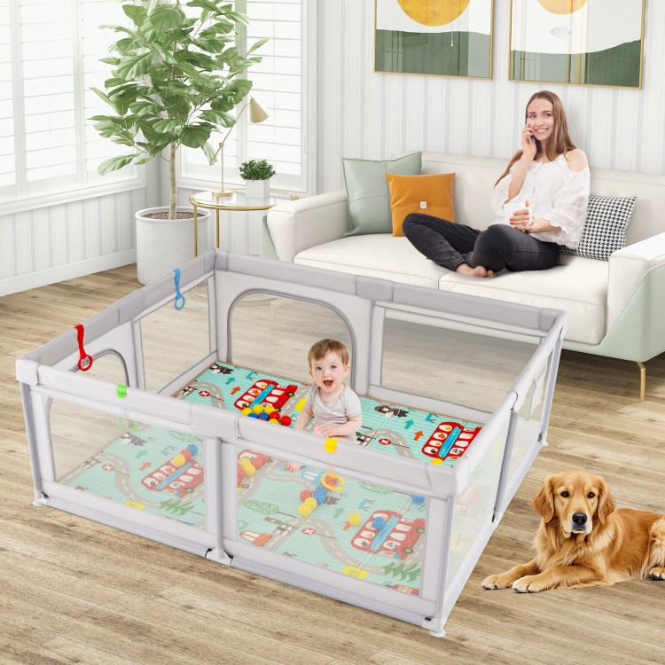 Baby playpen in gray with breathable mesh, non-slip mat, and toys, perfect for safe playtime and learning to stand.
