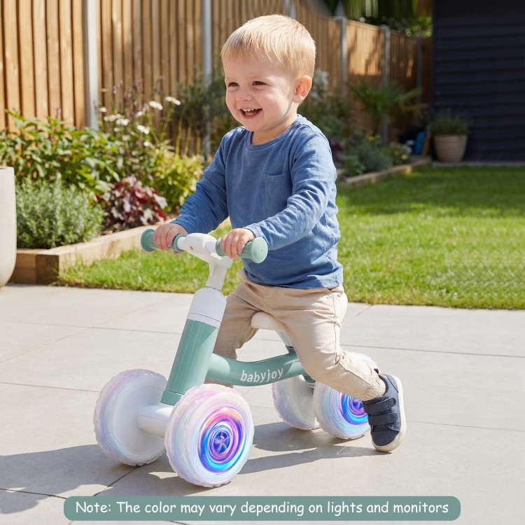 Baby balance bike in green with lighting wheels, adjustable seat and handlebars for kids, perfect for indoor and.