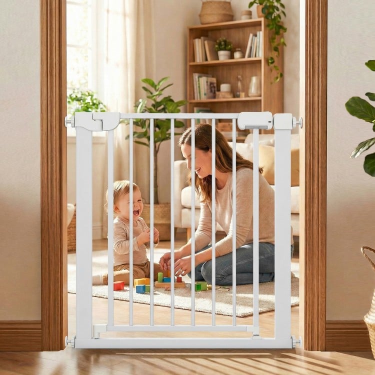 White baby gate for stairs, pressure mounted with auto-close feature, suitable for doorways and staircases.