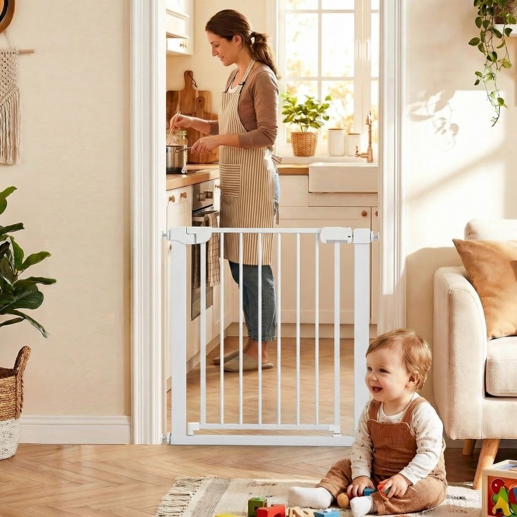 Pressure-mounted baby gate in white, featuring auto-close and double-lock safety, ideal for doorways and kitchens.