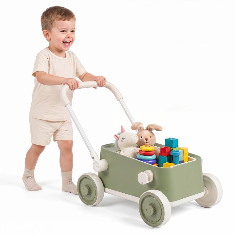 Toddler pushing a green Baby Push Walker with wheels, filled with toys and building blocks for imaginative play.