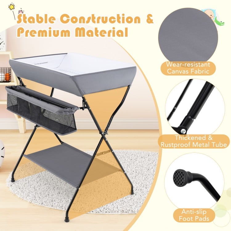 Folding baby changing table in gray with waterproof PVC, three compartments, and sturdy metal frame for easy diaper.
