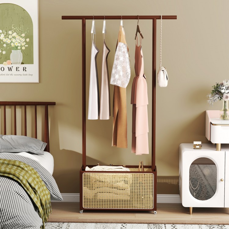 Bamboo clothes rack with hanging rod and rattan storage basket on wheels, ideal for stylish organization in any room.