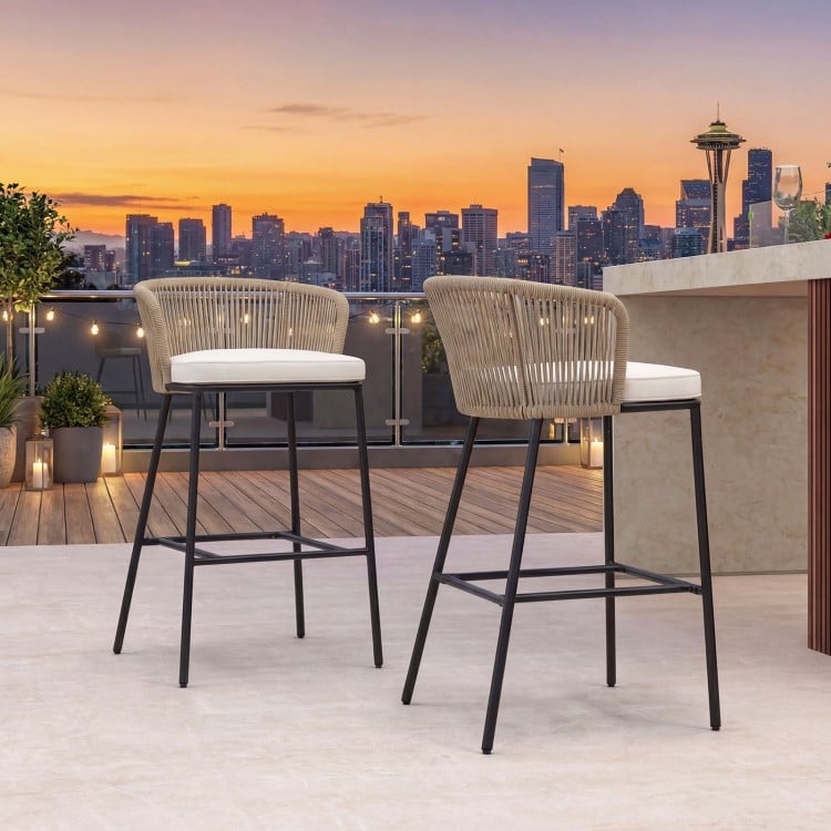 Bar height woven rope patio chairs set of 2 in white with soft cushions, ideal for outdoor relaxation on a balcony.