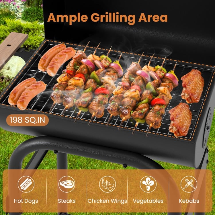 Barrel charcoal grill showcasing ample grilling area with kebabs, hot dogs, and chicken wings, perfect for outdoor.