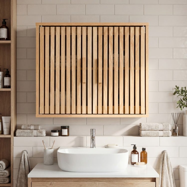 Bathroom wall cabinet with slatted doors and adjustable shelves, perfect for organized storage in any space.
