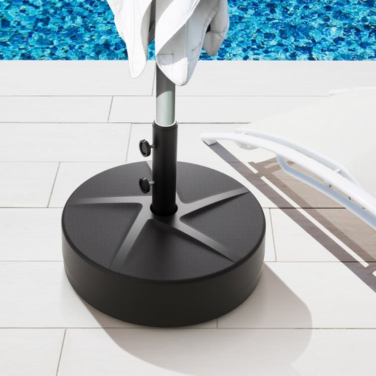 Patio umbrella base in black, 88 lbs capacity, filled with sand or water for stability, suitable for various umbrella.