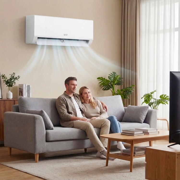 Mini split air conditioner and heater with inverter technology, shown in a living room, providing year-round comfort.