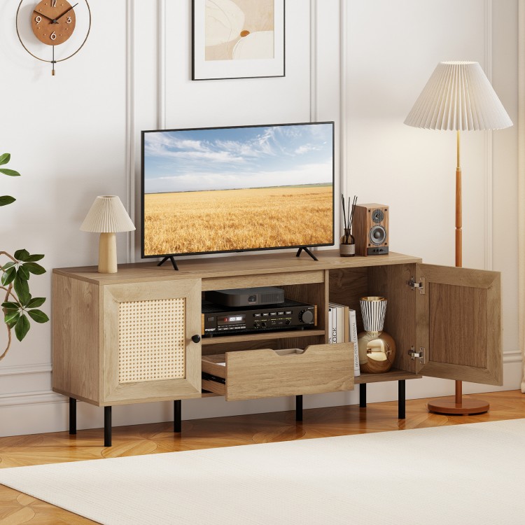 Boho TV stand with natural finish, featuring rattan doors, spacious storage, and metal legs for stability. Ideal for.