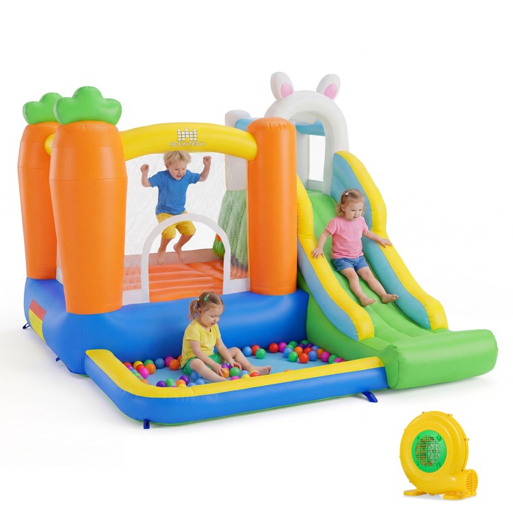 Colorful bounce house with climbing wall, slide, and ball pit for kids aged 3-12, perfect for backyard parties.