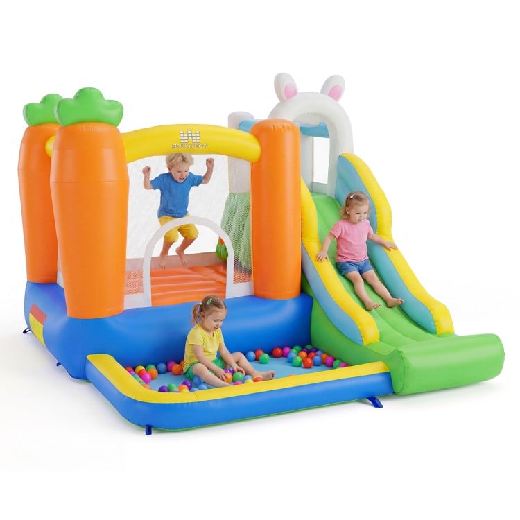 Bounce house with climbing wall and slide, featuring a ball pit, for kids aged 3-12, perfect for backyard parties.