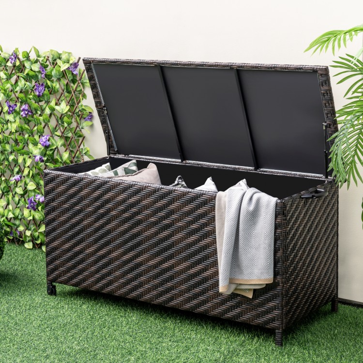 Outdoor storage box with removable liner, 85-gallon capacity, brown PE wicker, ideal for cushions and garden tools.