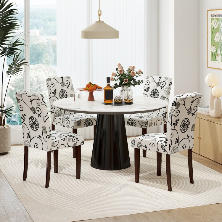 Button tufted beige dining chairs with high curved backs, featuring plush padding and sturdy rubber wood legs for.