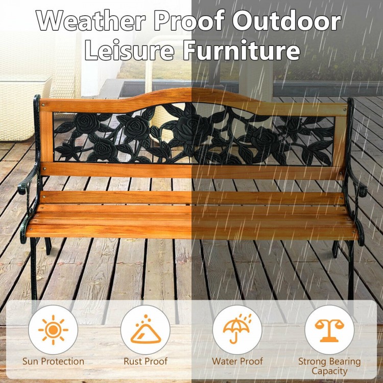 Close-up of the rose pattern backrest on the outdoor bench, featuring durable cast iron and solid wood construction.