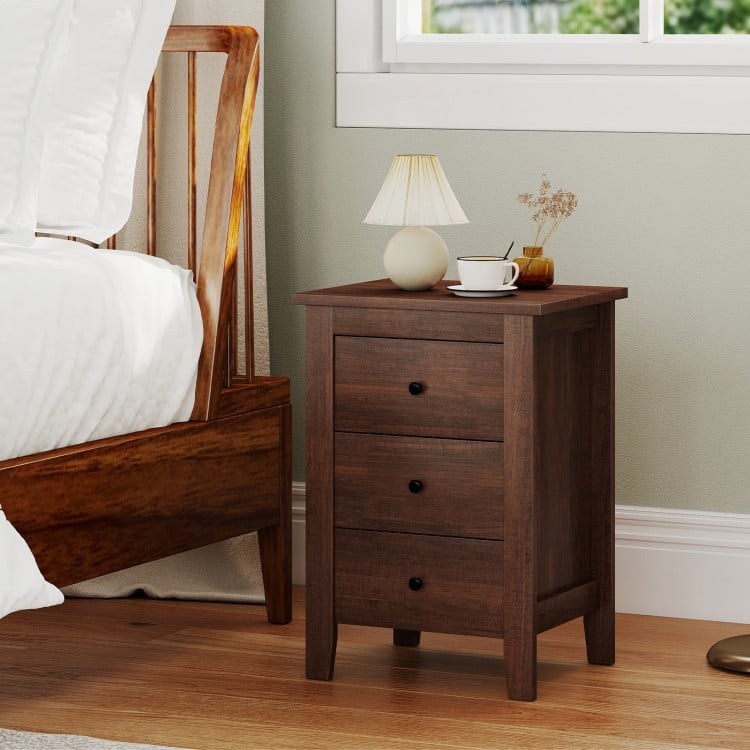 Walnut nightstand with three drawers, featuring a sleek design for space-saving storage in any room.