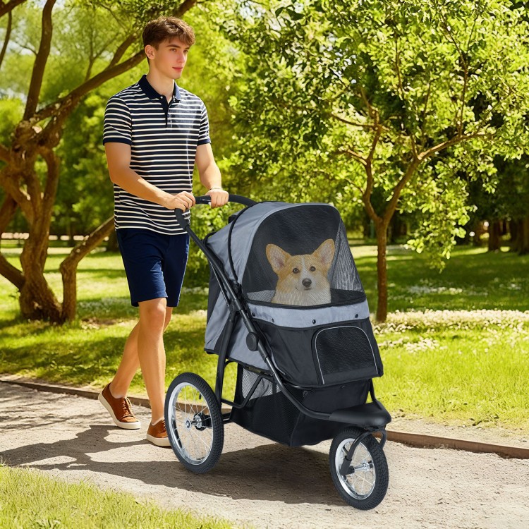 3-wheel pet stroller in gray with mesh sides, suitable for small dogs, shown on a path with a corgi inside.