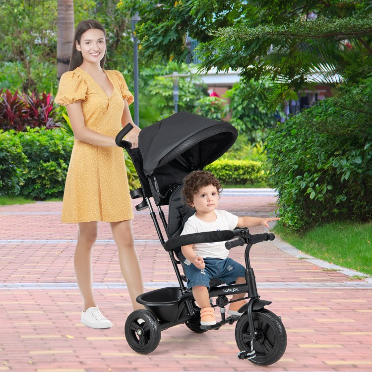 4-in-1 baby trike in grey with adjustable push handle and removable canopy, perfect for outdoor strolls with kids.