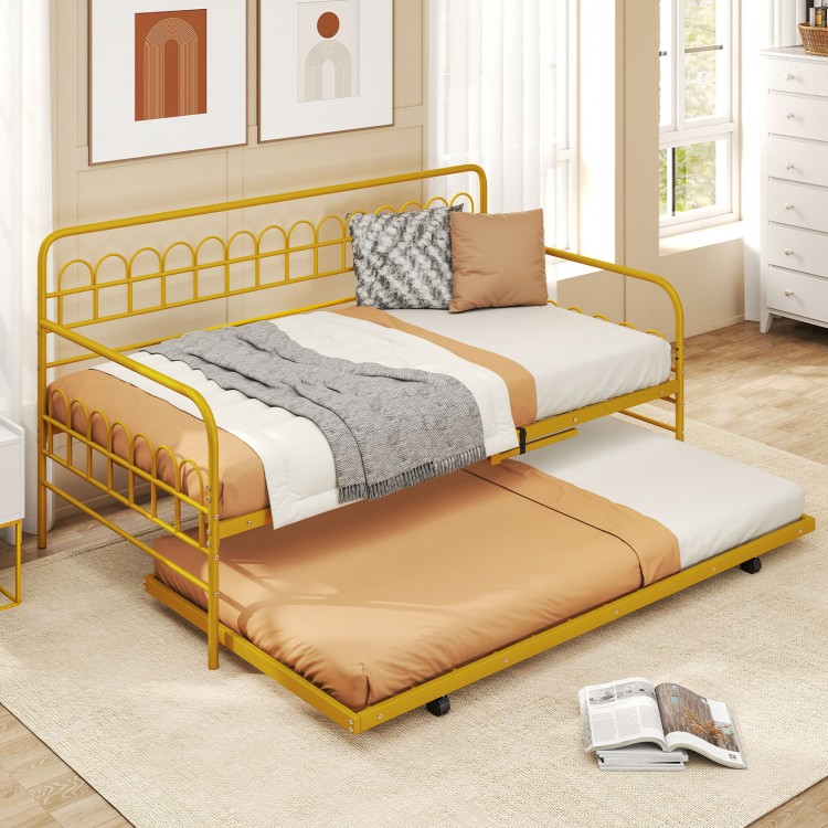 Twin daybed with curved backrest in gold, featuring a pull-out trundle for extra sleeping space in limited areas.