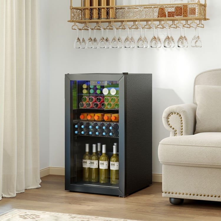 Beverage refrigerator cooler with glass door, black finish, showcasing drinks and adjustable shelves for home or office.