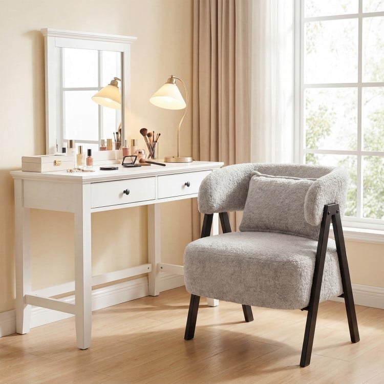 Gray barrel accent chair with faux rabbit fur upholstery and heavy-duty metal legs, ideal for living room or office use.