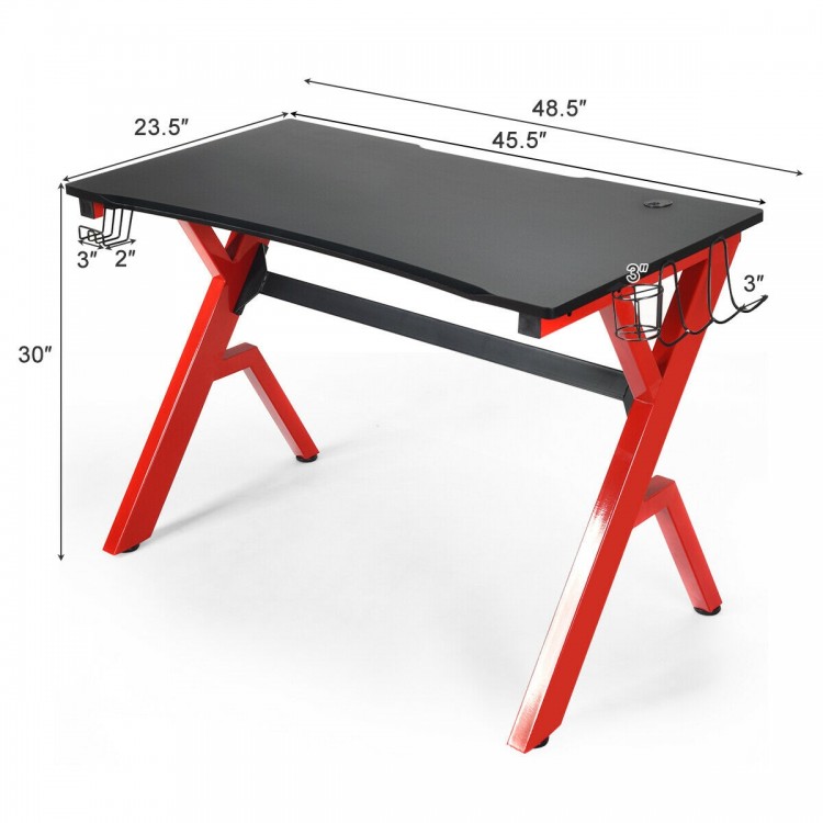Ergonomic gaming desk with carbon fiber surface, R-shape steel frame, and cable management for organized gaming setup.