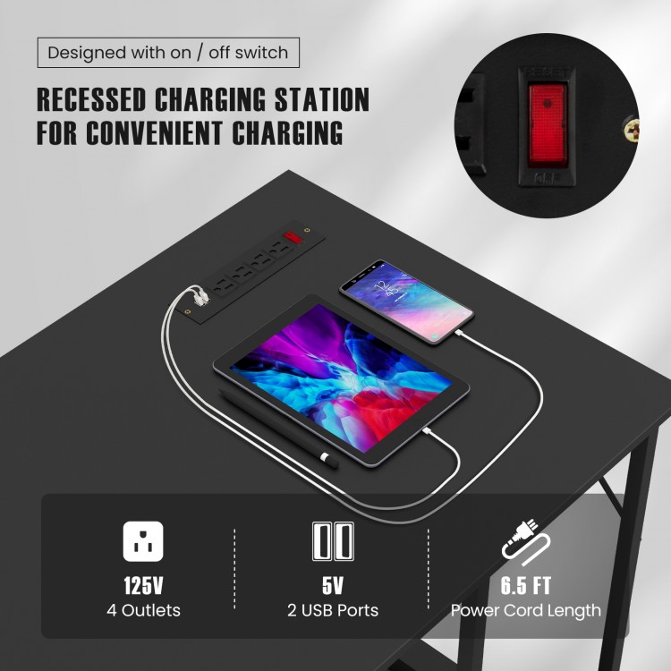 Recessed charging station with 4 outlets and 2 USB ports on a 55-inch black computer desk for convenient charging.