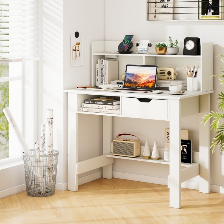 Home office computer desk in white with storage shelves, drawer, and built-in charging ports for organized workspace.
