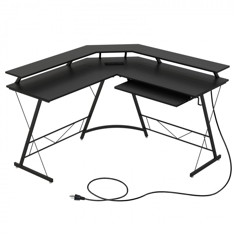 L-shaped black computer desk with power outlet, monitor stand, and reversible keyboard tray for efficient workspace.
