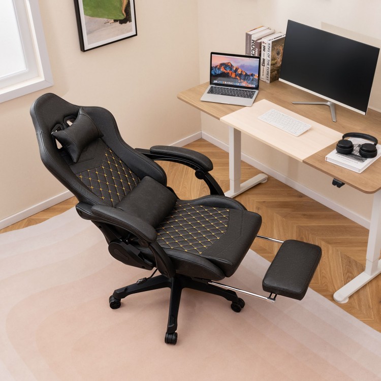 Ergonomic black video game chair with headrest, lumbar pillow, and retractable footrest for ultimate comfort and.