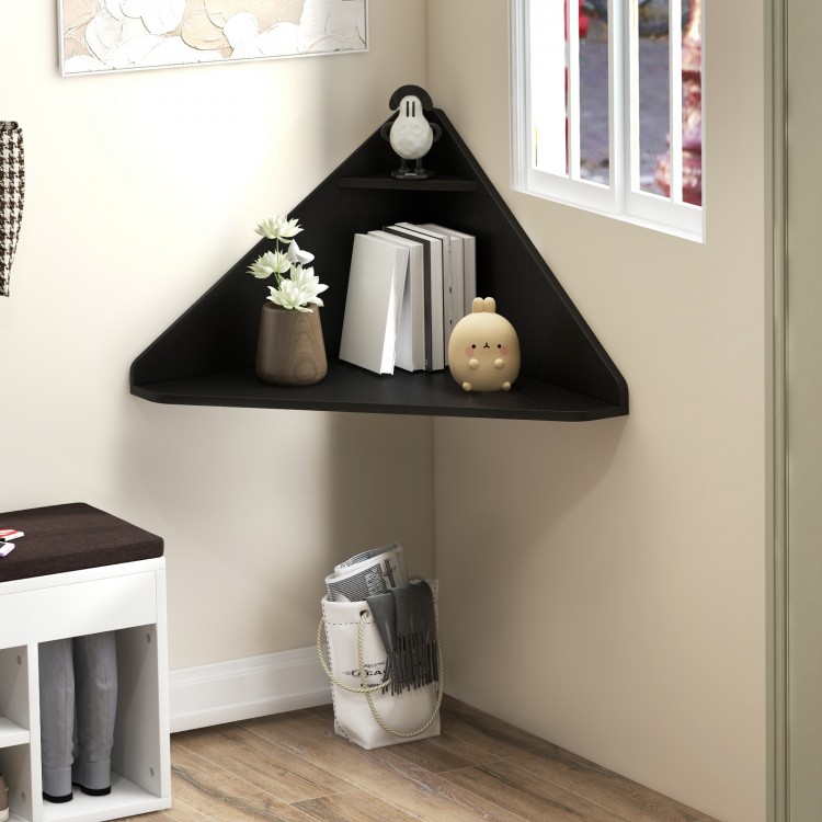 Floating triangular corner desk in black with storage shelf, perfect for compact spaces in living room or office.
