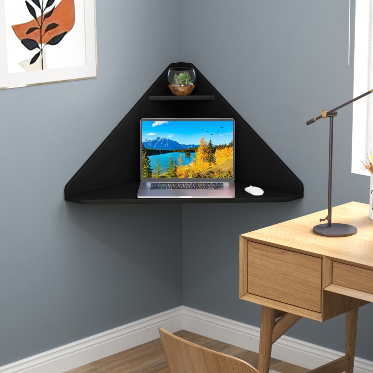 Floating triangular corner computer desk in black with storage shelf, ideal for maximizing space in any room.
