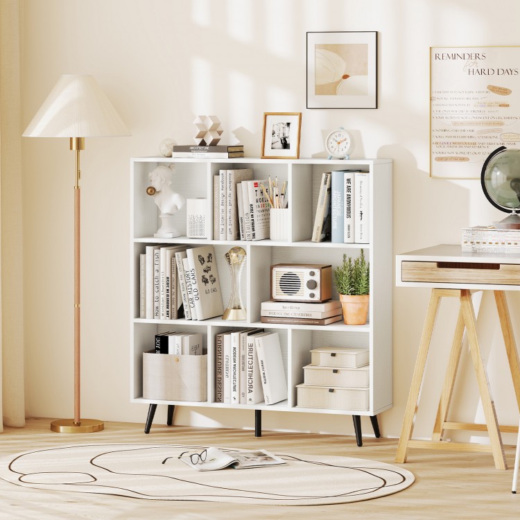 8-cube bookcase in white with 5 tapered metal legs, perfect for storing books and decor in a stylish living space.